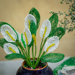 A bouquet of flowers made of beads.