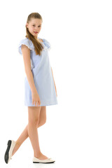 Portrait of Teen Girl in Light Blue Dress Standing Half Turn