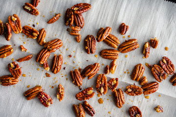 Sweet and Spicy Toasted Pecans: Candied pecans with honey, nutmeg, and red pepper flakes