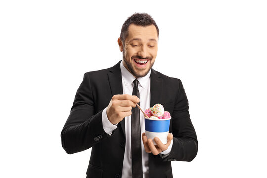 Young Businessman Eating Ice Cream From A Paper Cup