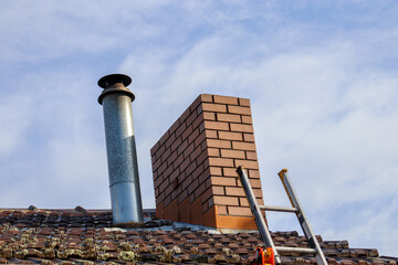 ladder to roof with chimney