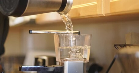 Measuring distilled water for coffee maker, Close Up
