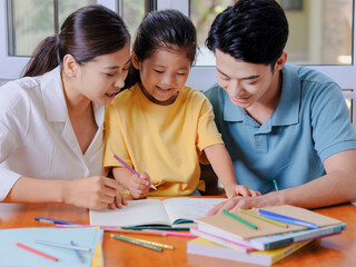 Young parents help their children with their homework