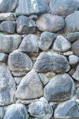 Texture of a stone wall. Old castle stone wall texture background. Stone wall as a background or texture. Part of a stone wall, for background or texture. High quality photo