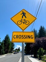 Road signs warning drivers to be cautious of pedestrians and bicycles