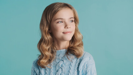 Beautiful haired smiling teenager girl dressed in cozy sweater l