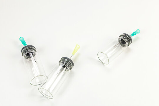 Glass bottle for vaccines on white background