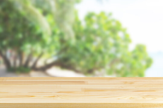 Wood Table Top On Blurred Green Wood Background