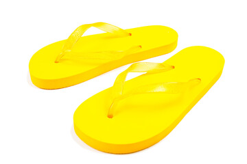 yellow rubber beach flip flops on a white background, isolate