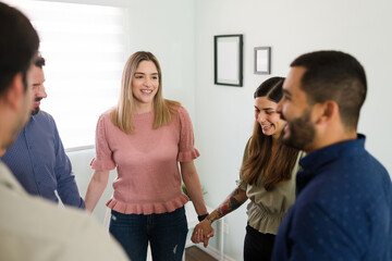 Cheerful woman speaking about a funny story at therapy