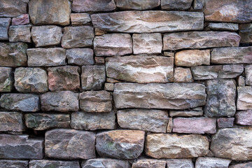 Stacked stone wall close-up for background texture