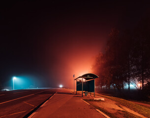 bus stop on a foggy autumn night.