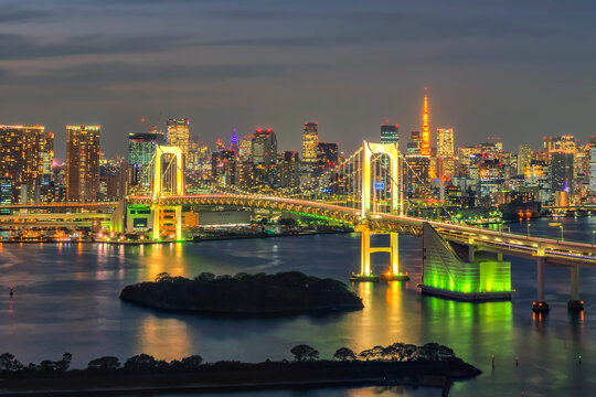 Illumination of Rainbow Bridge and Tokyo Tower with Skyscrapers Background, Odiaba, Tokyo, Japan