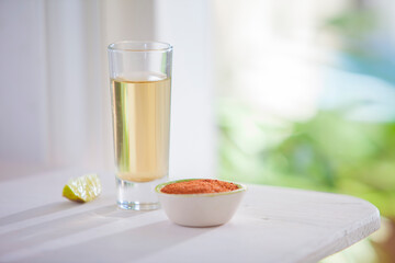 shot of tequila with chili and lime