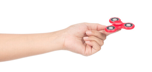 fingers playing a red fidget spinner isolated on a white background - obrazy, fototapety, plakaty