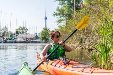 Fotobehang Sea Kayaking on the Toronto Islands on a sunny June afternoon. © Michael Connor Photo