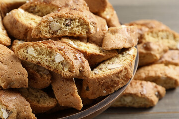 Traditional Italian almond biscuits (Cantucci) in bowl on table, closeup