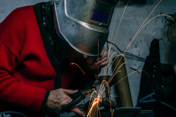 grandfather welding in workshop