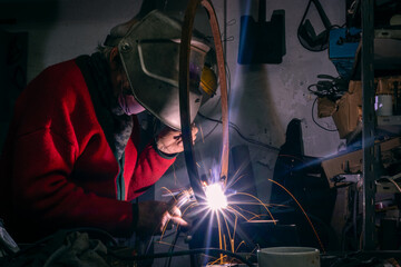 grandfather welding in workshop