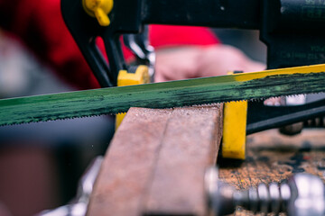 close up of a saw cutting wood