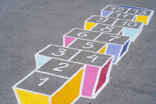 A colorful game of classics. A bright street child's play. Summer games for children. Bright childish drawing with chalk
