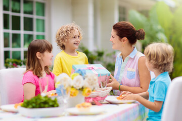 Family eating outdoor. Garden summer fun.