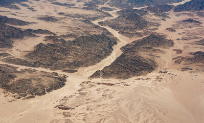 Beautiful aerial view landscape of mountains peaks in desert. Sahara desert, view from the airplane