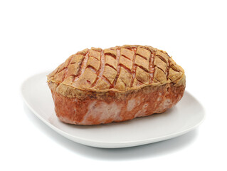 whole traditional warm bavarian meat loaf on a white plate served isolated on white background