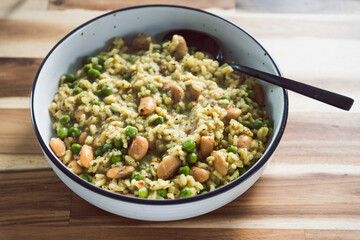 vegan peas and white beans risotto with nutritional yeast, healthy plant-based food