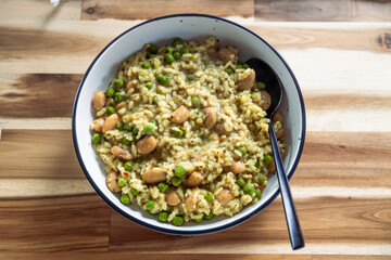 vegan peas and white beans risotto with nutritional yeast, healthy plant-based food