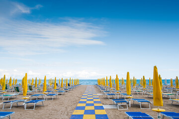 Beach resort with sun beds and beach umbrellas