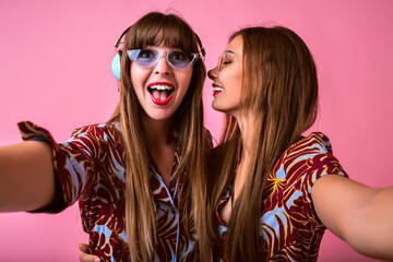 Positive studio portrait of two happy sister best friend woman