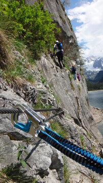 Snap hook on steel rope in via ferrata in Austria