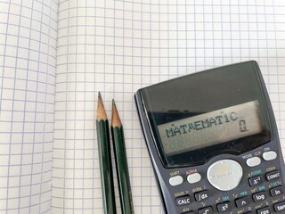 calculator and pencil on paper