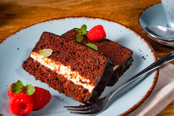 Rustic chocolate cake with raspberries and coffee