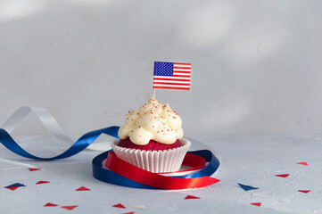 Cupcake with American flag decorated with ribbons, the 4th of July celebration.