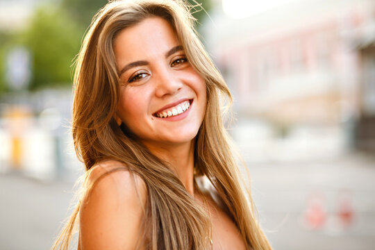 Elegant young magnificent woman with big brown eyes and amazing smile