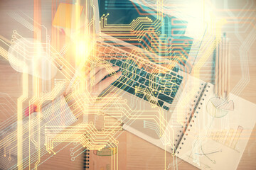 Multi exposure of man's hands typing over computer keyboard and world map hologram drawing. Top view. Technology concept.