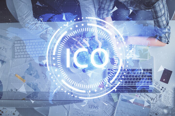 Double exposure of man and woman working together and crypto theme hologram drawing. Computer...