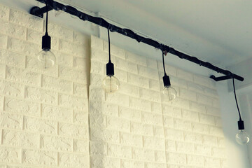  light bulbs hanging on ceiling in the restaurant.