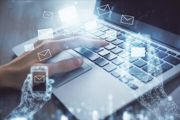 Double exposure of woman hands typing on computer and flying envelop drawing. E-Mail concept.