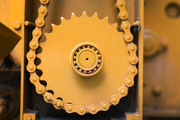 Closeup of orange gearwheel