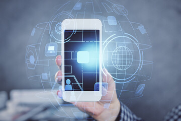 Double exposure of man's hands holding and using a phone and social network theme drawing.