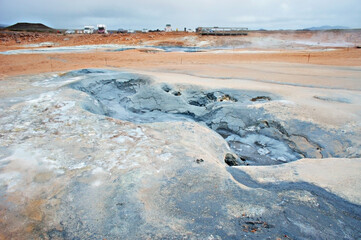 Hverir geothermal area in North of Iceland, Boiling volcano mud pots and cracked red ground, Geothermal alternative energy, Namafjall