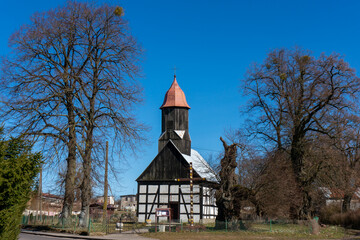 Church of the Holy Apostles Peter and Paul (kościół św. Apostołów Piotra i Pawła) is half-timbered temple with wooden tower topped with a baroque dome. Rekowo (village in Łobez County), Poland.