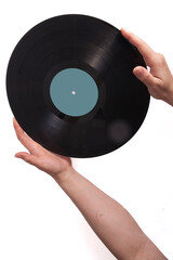 Musical background, guitar and old vinyl records in female hands