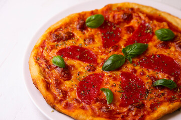 Pizza with salami. Traditional italian recipe.