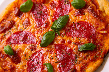 Pizza with salami. Traditional italian recipe.