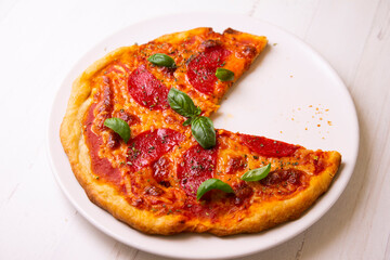 Pizza with salami. Traditional italian recipe.