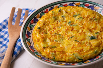 Traditional Spanish omelette with zucchini and potatoes.